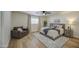 This bedroom has an accent chair, ceiling fan, and a beautiful rug that makes the room look bigger and cozy at 1263 W Devonshire St, Mesa, AZ 85201