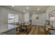 Kitchen dining area features a wooden table, chairs, and bright window views at 1263 W Devonshire St, Mesa, AZ 85201