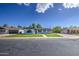 Charming single-story home with lush green lawn, walkway, and freshly painted exterior for great curb appeal at 1263 W Devonshire St, Mesa, AZ 85201