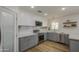 Bright kitchen featuring custom cabinets, stainless steel appliances, subway tile backsplash, and granite countertops at 1263 W Devonshire St, Mesa, AZ 85201