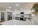 Beautifully updated kitchen with stainless appliances, island, modern lighting and subway tile backsplash at 1263 W Devonshire St, Mesa, AZ 85201