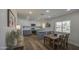 Spacious kitchen with a dining table and stainless steel appliances, perfect for Gathering gatherings at 1263 W Devonshire St, Mesa, AZ 85201