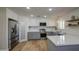 Bright kitchen features stainless steel appliances, a stylish backsplash, and a convenient walk-in pantry at 1263 W Devonshire St, Mesa, AZ 85201