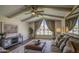 Comfortable living room with vaulted ceilings, large windows, designer furnishings and hardwood floors at 1263 W Devonshire St, Mesa, AZ 85201