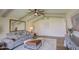Comfortable living room with vaulted ceilings, large windows, designer furnishings and hardwood floors at 1263 W Devonshire St, Mesa, AZ 85201