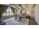 Comfortable living room with vaulted ceilings, large windows, designer furnishings and hardwood floors at 1263 W Devonshire St, Mesa, AZ 85201