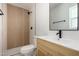 Beautiful bathroom featuring a wood accent wall in the shower and modern hardware fixtures at 1313 N 71St St, Scottsdale, AZ 85257
