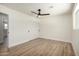 Bright bedroom with wood-look floors, sliding door closet and a window bringing in lots of natural light at 1313 N 71St St, Scottsdale, AZ 85257
