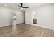Bedroom with wood-look floors, modern fan, and white trim at 1313 N 71St St, Scottsdale, AZ 85257