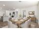 Elegant dining room features a wooden table set with plates and glasses, adjacent to the modern kitchen at 1313 N 71St St, Scottsdale, AZ 85257