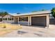 Charming single story home featuring attached garage, covered front entrance, and neutral exterior paint at 1313 N 71St St, Scottsdale, AZ 85257