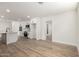 Spacious open kitchen with white cabinets, stainless appliances, and wood-look flooring at 1313 N 71St St, Scottsdale, AZ 85257