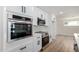 Gorgeous kitchen with white cabinetry, quartz countertops, and stainless steel appliances at 1313 N 71St St, Scottsdale, AZ 85257