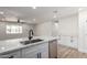 Beautiful kitchen with updated appliances, quartz countertops, and island with wood accents at 1313 N 71St St, Scottsdale, AZ 85257