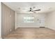 Bright, airy living room showcasing the decorative wood wall and entry door at 1313 N 71St St, Scottsdale, AZ 85257
