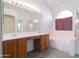 Bright bathroom featuring double sinks, a tub, and lots of natural light at 1463 W Mead Dr, Chandler, AZ 85248