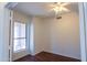 Bright bedroom featuring wood look floors and large window at 1463 W Mead Dr, Chandler, AZ 85248