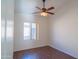 This bedroom features a ceiling fan and a large window at 1463 W Mead Dr, Chandler, AZ 85248