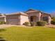 Well-kept single-story home with desert landscaping, a two-car garage, and a welcoming front lawn at 1463 W Mead Dr, Chandler, AZ 85248