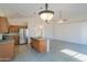 Bright kitchen boasts stainless steel appliances, an island with a sink, and generous counter space at 1463 W Mead Dr, Chandler, AZ 85248
