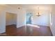 Spacious living room featuring wood-look floors, adjacent rooms, and natural light at 1463 W Mead Dr, Chandler, AZ 85248