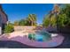 Backyard pool with stone features, mature landscaping and block wall at 1463 W Mead Dr, Chandler, AZ 85248