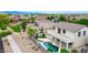 Backyard oasis featuring a sparkling pool, spa, and patio perfect for entertaining or relaxing, with desert landscaping at 14823 W Windsor Ave, Goodyear, AZ 85395