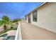 Upper level balcony with a concrete patio and view of the pool, yard, and neighborhood at 14823 W Windsor Ave, Goodyear, AZ 85395