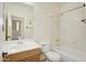 Bright bathroom featuring tub, toilet and single sink vanity at 14823 W Windsor Ave, Goodyear, AZ 85395