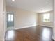 Bright, large bedroom boasts hardwood floors and plenty of natural light from its windows at 14823 W Windsor Ave, Goodyear, AZ 85395