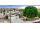Charming two-story home with a three-car garage and a well-manicured lawn with stone accents and desert landscaping at 14823 W Windsor Ave, Goodyear, AZ 85395