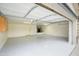 Spacious three-car garage with epoxy floors, storage cabinets, and a water softener system at 14823 W Windsor Ave, Goodyear, AZ 85395