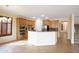 Kitchen area featuring tile floors, granite counters, wooden cabinets, and stainless appliances at 14823 W Windsor Ave, Goodyear, AZ 85395