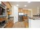 Kitchen area with granite counters, stainless appliances, and a center island with a breakfast bar at 14823 W Windsor Ave, Goodyear, AZ 85395