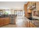 Kitchen featuring granite counters, stainless appliances, and plenty of cabinets at 14823 W Windsor Ave, Goodyear, AZ 85395