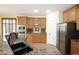 Spacious kitchen features granite counters, stainless appliances, and wood cabinetry at 14823 W Windsor Ave, Goodyear, AZ 85395