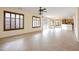 Open concept living room with tile flooring and a view of the kitchen at 14823 W Windsor Ave, Goodyear, AZ 85395