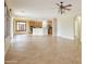 Open concept living room featuring tile floors and views of the kitchen at 14823 W Windsor Ave, Goodyear, AZ 85395