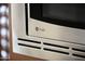 Close-up of a stainless steel GE Profile microwave in a modern kitchen at 14823 W Windsor Ave, Goodyear, AZ 85395
