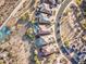 Birds eye view showing many residences, swimming pools, landscaping, and desert areas at 17009 S Coleman St, Phoenix, AZ 85045
