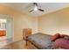 Bedroom featuring a ceiling fan, carpet, and ensuite bathroom at 17009 S Coleman St, Phoenix, AZ 85045