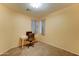 Neutral bedroom with a desk, chair, and carpeted floor, with a natural light at 17009 S Coleman St, Phoenix, AZ 85045