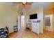 Spacious bedroom with tiled floor and a ceiling fan. Has access to an ensuite bathroom at 17009 S Coleman St, Phoenix, AZ 85045