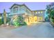 Charming two-story home features a well-maintained yard with lush landscaping and a welcoming entrance at 17009 S Coleman St, Phoenix, AZ 85045