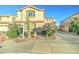 Beautiful home featuring desert landscaping with flowering bushes, cactus, and a well-manicured lawn at 17009 S Coleman St, Phoenix, AZ 85045