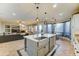 Open concept kitchen with a large island, stainless steel dishwasher, and view to living room and dining nook at 17009 S Coleman St, Phoenix, AZ 85045