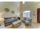 Bright and airy living room features high ceilings, natural light, and stylish decor for comfortable living at 17009 S Coleman St, Phoenix, AZ 85045