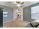 Cozy living room space with neutral tones, featuring tiled floor and a glimpse of staircase at 17009 S Coleman St, Phoenix, AZ 85045