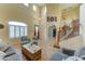 Inviting living room with soaring ceilings, a staircase, and comfortable seating, ideal for relaxing and entertaining at 17009 S Coleman St, Phoenix, AZ 85045