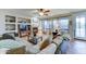 Inviting living room with fireplace, built-in shelving, and lots of natural light at 17009 S Coleman St, Phoenix, AZ 85045